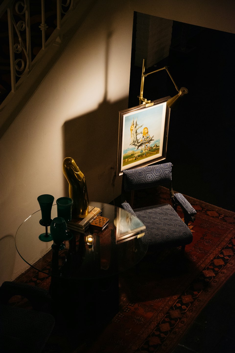 Luxurious reading nook with armchair and sculptural details.